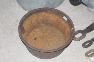 A small cast iron circular trough