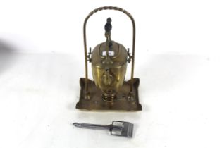 A brass spirit kettle on stand