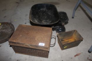 A set of shop scales, a tin box with two handles a