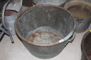 A C19 copper and brass twin handle cauldron