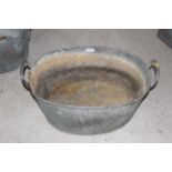 A galvanised oval bath