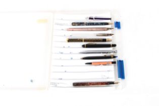 A box containing ten various pens