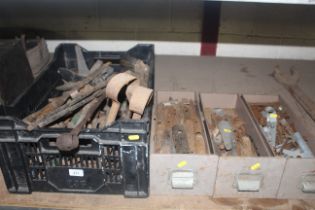 A large plastic crate of hand tools and three meta