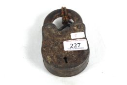 A large metal padlock with key
