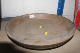 An old circular wooden plate