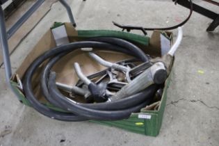 A quantity of fuel hoses and nozzles