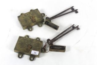 A pair of ornate brass 20th Century door locks wit