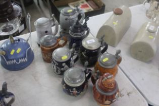 Nine ceramic and decorative beer Steins with metal