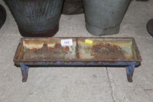 A small two section cast iron trough