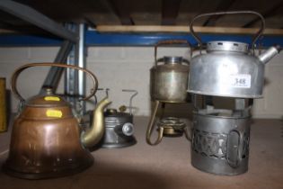 Three various portable stoves and kettles