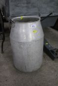 An aluminium churn with handle and no lid
