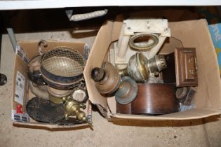 Two boxes containing various metalware; clocks etc