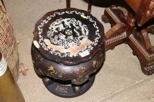 A Chinese lacquered and decorated plant stand with