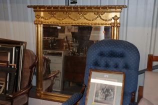 A gilt framed bevel edged overmantel mirror