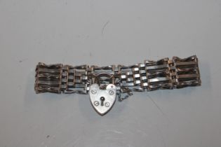 A hallmarked sterling silver five bar gate link bracelet with padlock clasp