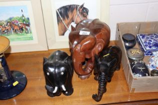 Three carved wooden elephants