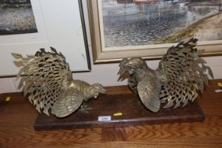 A pair of cockerels mounted to oak base