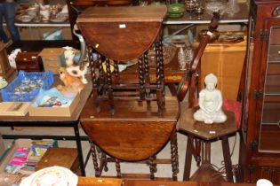 Two oak and barley twist gateleg drop leaf tables