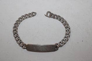 A vintage solid sterling silver ID bracelet with v