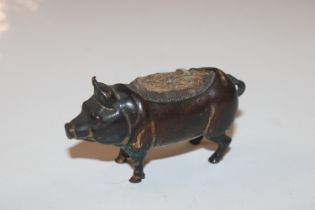 A novelty pin cushion in the form of a pig
