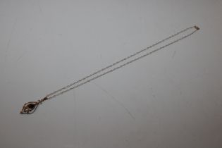A 9ct gold and garnet pendant and chain, approx. 1