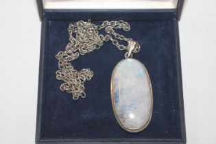 A large sterling silver and moonstone pendant and chain, approx. 39gms