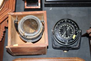 A Sowester Bosun Heath London ships compass and a WWII era AM ships compass in fitted wooden case