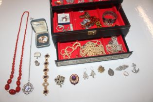 A cantilever jewellery box and contents of various