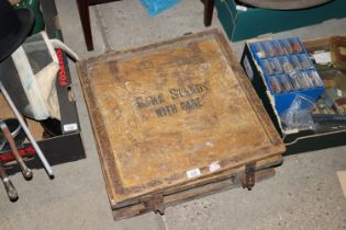 A wedding cake stand in wooden crate