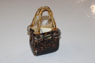 A Venetian glass model of a handbag