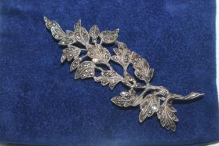 An antique hallmarked sterling silver and marcasite foliate spray brooch, approx. 13gms