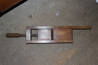 A vintage wooden clamp