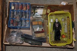 A box containing various diecast vehicles to inclu