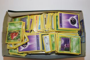 A box of various Pokemon cards to include first an