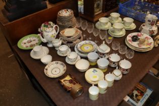 A quantity of various tea ware, floral encrusted ornaments and table glassware