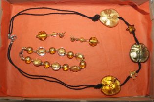 A Venetian glass bead necklace and matching ear-ri