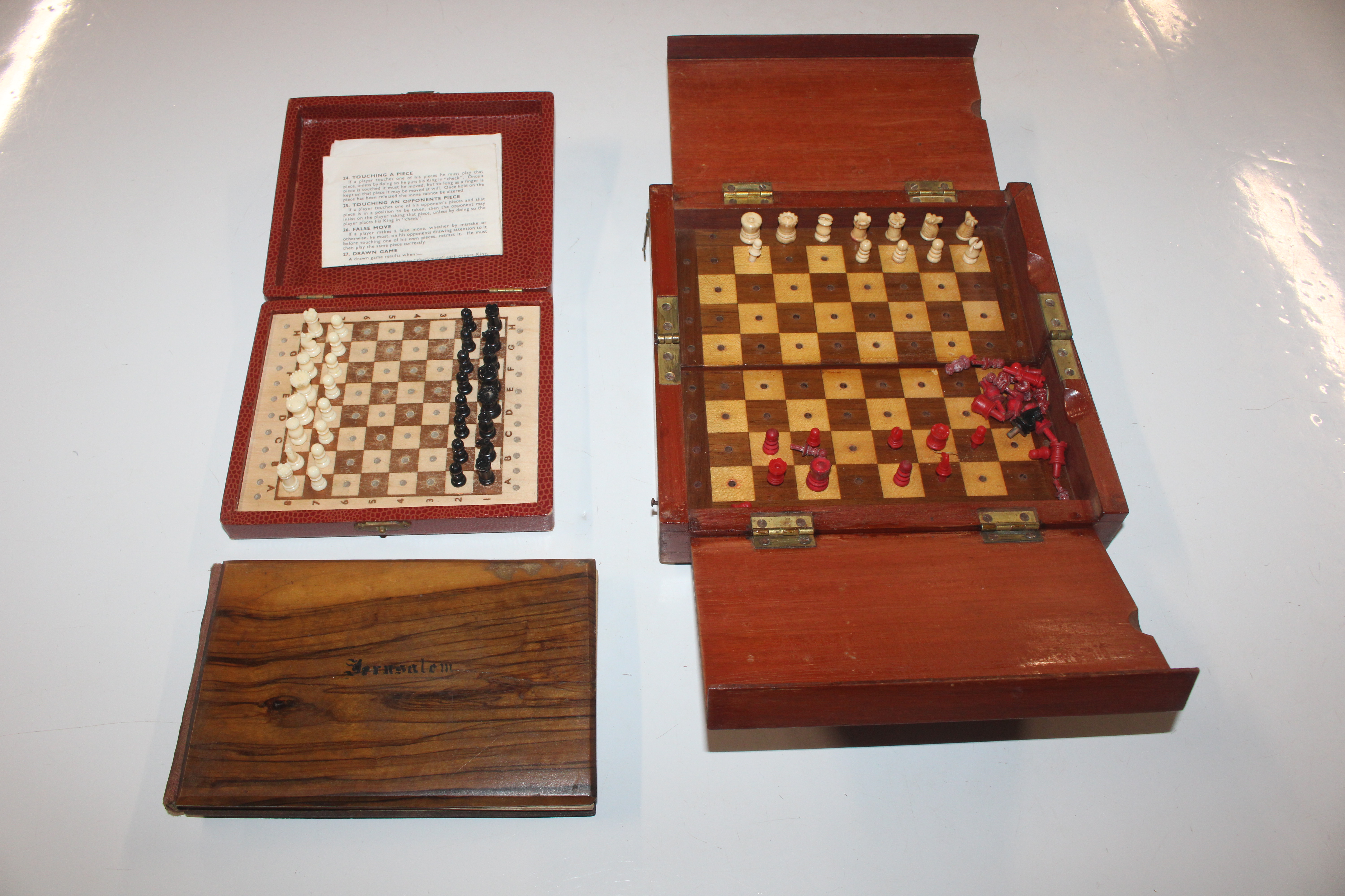 A K & C travelling chess set; a wooden folding tra