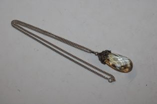 A large Art Nouveau silver and citrine pendant and