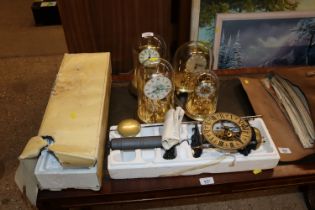 A Tempus Fugit wall clock and four anniversary clo