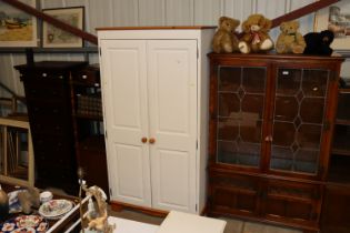 A white painted pine two door wardrobe