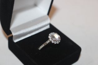 A 925 silver and cubic zirconia cluster ring