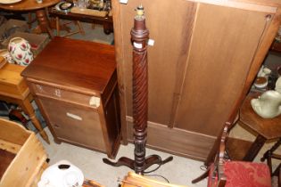 A turned mahogany standard lamp