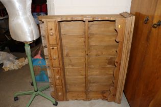 A hanging pine plate rack fitted four drawers