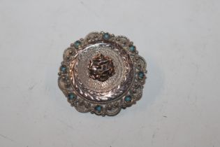 An antique sterling silver, gold and turquoise tar