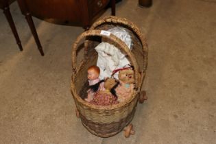 A vintage wicker dolls pram and contents of variou