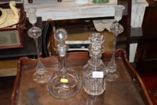 Two decanters and stoppers and a pair of glass can