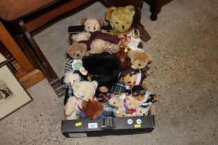 A box containing various teddy bears to include Ch