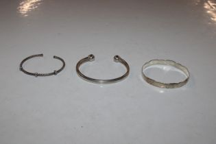 Three solid silver bangles, approx. 37gms total weight