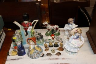 A quantity of wade whimsies, novelty teapot, two coalport figures