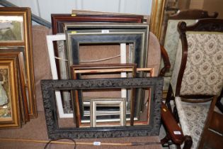 A quantity of various picture frames
